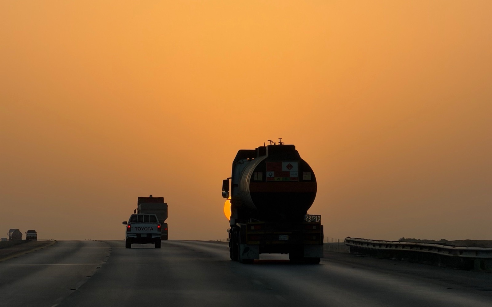 18-wheeler on a flat, open North Texas interstate at dusk