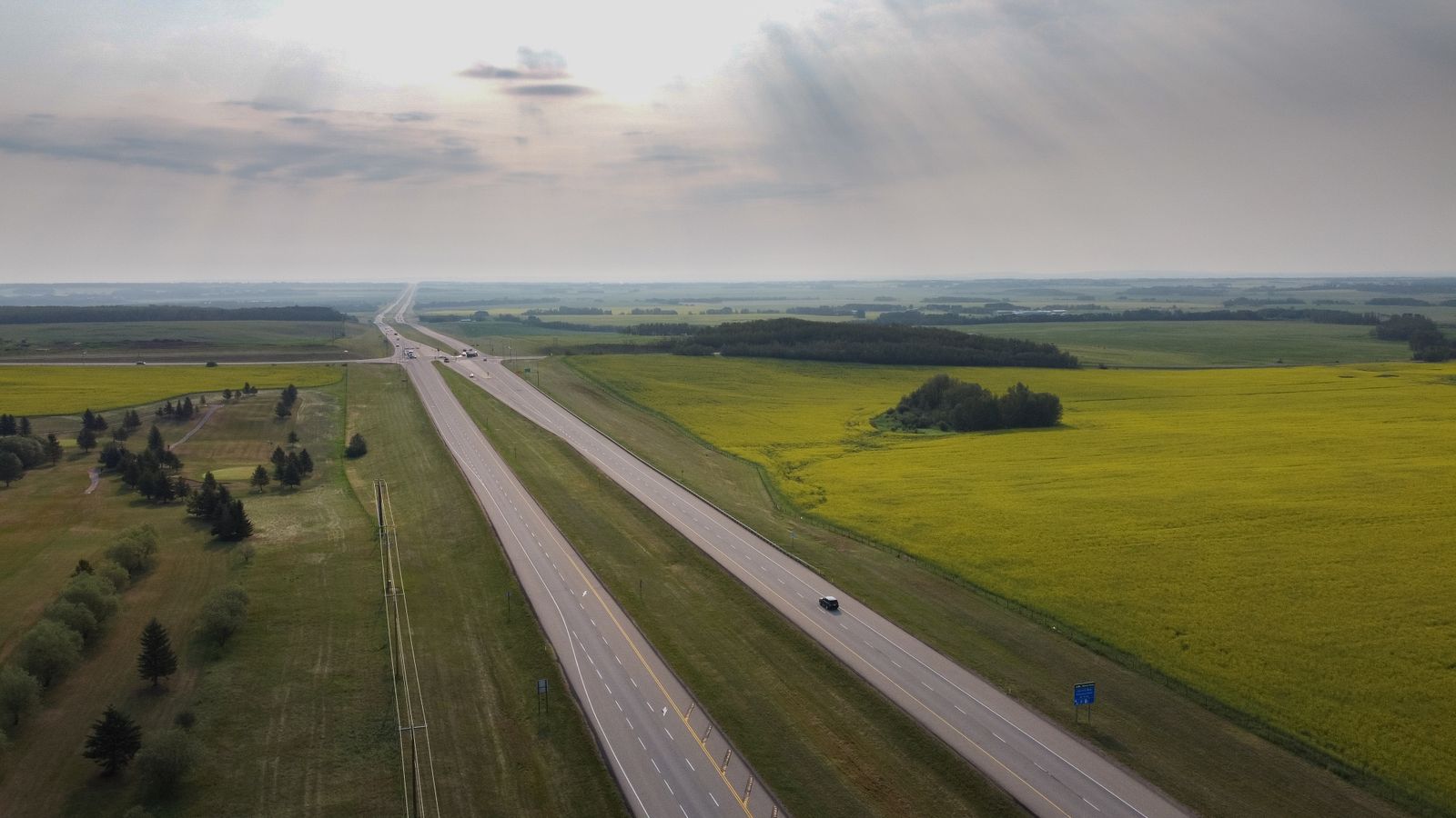 Aerial view of an open Texas interstate highway with light traffic
