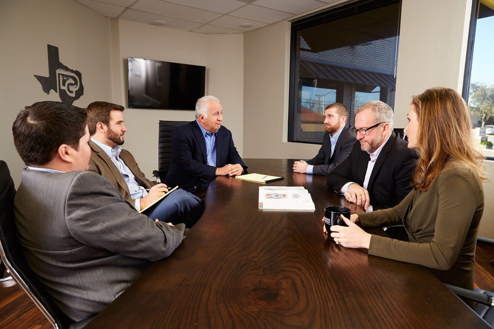 Travis patterson and the other attorneys having a meeting
