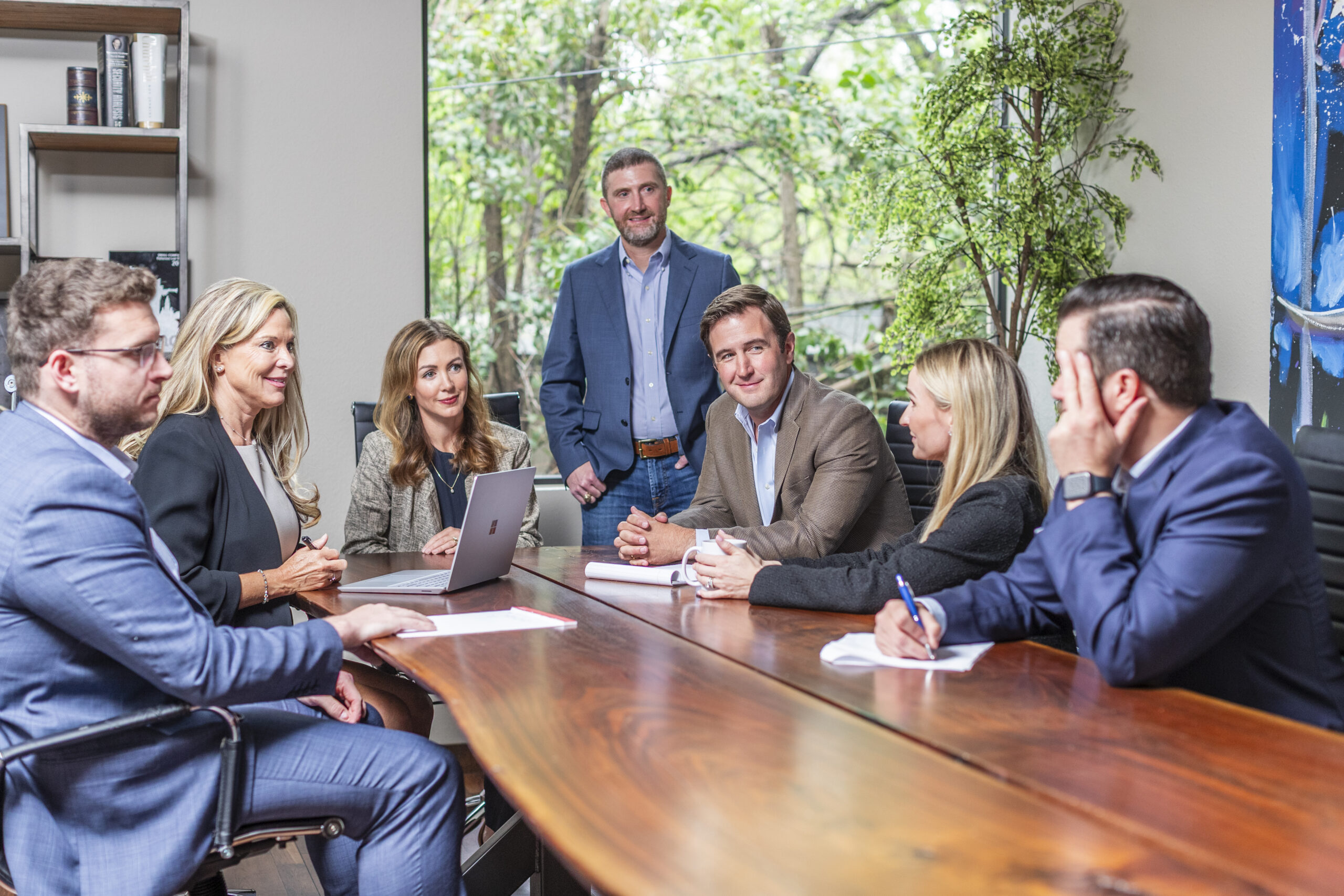 Patterson Law Group attorneys meeting with a client in a conference room in Fort Worth, TX